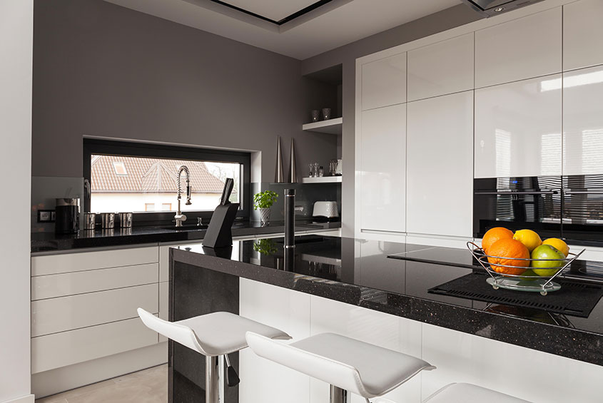 black granite countertop with white cabinets